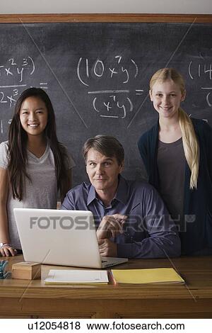 Portrait of maths teacher with two students (14-15) View Large Photo Image Stock Photo - Portrait of maths teacher with two students (14-15). Fotosearch