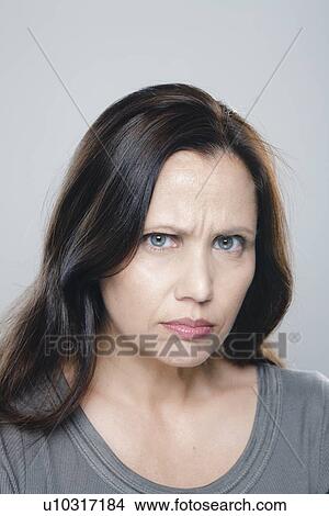 Picture - Portrait of mature woman, studio shot. Fotosearch