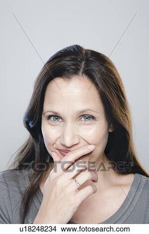 Portrait of mature woman, studio shot View Large Photo Image Picture - Portrait of mature woman, studio shot. Fotosearch