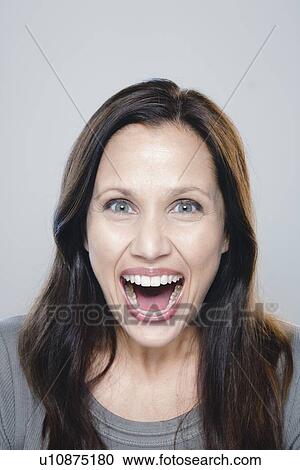Portrait of mature woman, studio shot View Large Photo Image Stock Image - Portrait of mature woman, studio shot. Fotosearch