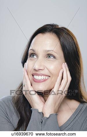 Portrait of mature woman, studio shot View Large Photo Image Stock Image - Portrait of mature woman, studio shot. Fotosearch