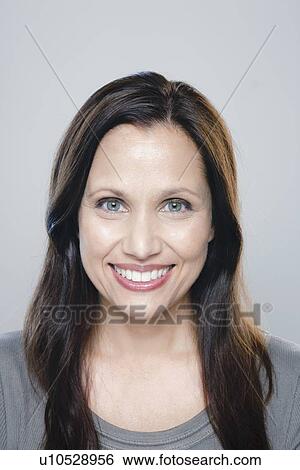 Portrait of mature woman, studio shot View Large Photo Image Stock Photograph - Portrait of mature woman, studio shot. Fotosearch