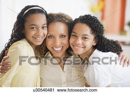 Portrait of mother with daughters (10-13) View Large Photo Image Stock Image - Portrait of mother with daughters (10-13). Fotosearch