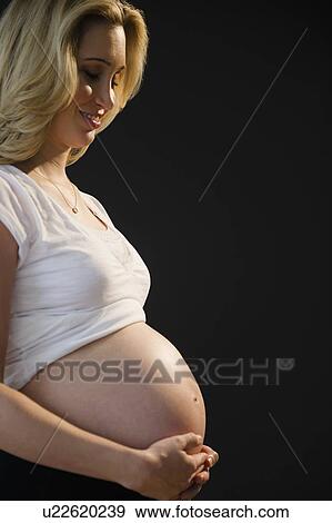 Stock Photo - Portrait of pregnant woman. Fotosearch