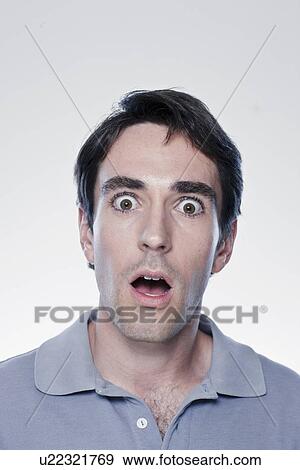 Portrait of scared man, studio shot View Large Photo Image Stock Photo - Portrait of scared man, studio shot. Fotosearch