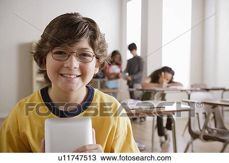 Stock Image - Portrait of schoolboy (10-11). Fotosearch