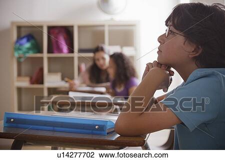 Portrait of schoolboy (10-11) contemplating View Large Photo Image Stock Image - Portrait of schoolboy (10-11) contemplating. Fotosearch