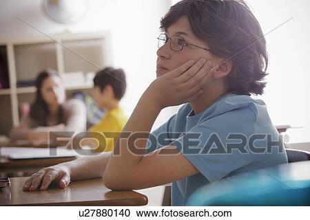 Portrait of schoolboy (10-11) contemplating View Large Photo Image Stock Image - Portrait of schoolboy (10-11) contemplating. Fotosearch