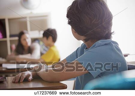Portrait of schoolboy (10-11) contemplating View Large Photo Image Stock Photo - Portrait of schoolboy (10-11) contemplating. Fotosearch