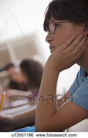 Portrait of schoolboy (10-11) contemplating View Large Photo Image Stock Photograph - Portrait of schoolboy (10-11) contemplating. Fotosearch
