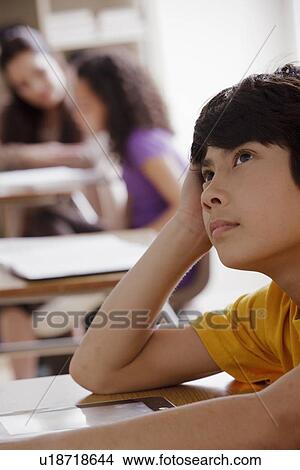 Portrait of schoolboy (12-13) contemplating View Large Photo Image Picture - Portrait of schoolboy (12-13) contemplating. Fotosearch