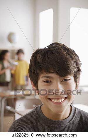 Stock Image - Portrait of schoolboy (12-13). Fotosearch