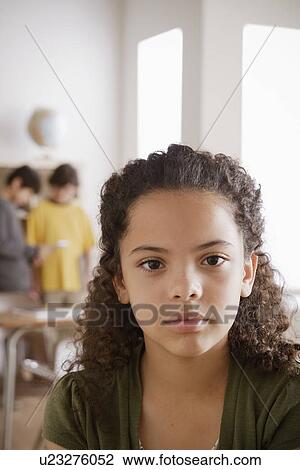 Stock Image - Portrait of schoolgirl (10-11). Fotosearch
