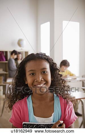 Stock Photo - Portrait of schoolgirl (10-11). Fotosearch