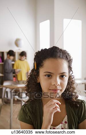 Stock Photography - Portrait of schoolgirl (10-11). Fotosearch