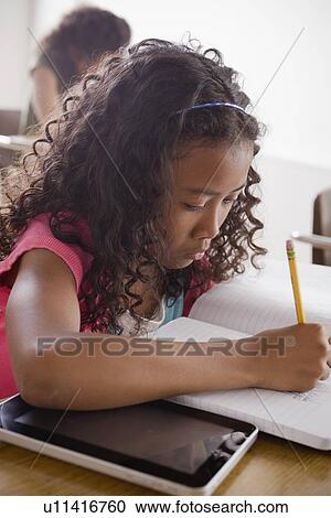 Portrait of schoolgirl (10-11) writing View Large Photo Image Stock Image - Portrait of schoolgirl (10-11) writing. Fotosearch