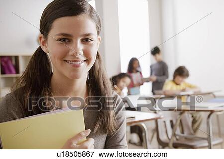 Stock Photo - Portrait of schoolgirl (12-13). Fotosearch