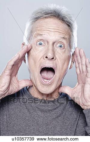 Stock Photo - Portrait of screaming senior man, studio shot. Fotosearch