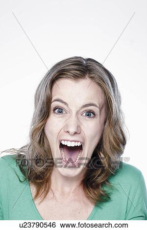 Portrait of screaming young woman, studio shot View Large Photo Image Stock Photograph - Portrait of screaming young woman, studio shot. Fotosearch