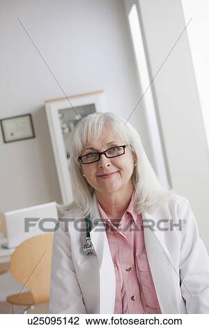 Stock Image - Portrait of senior doctor. Fotosearch