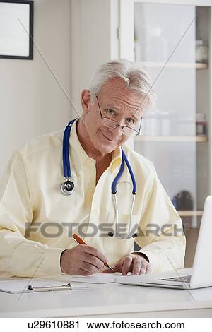 Portrait of senior doctor View Large Photo Image Stock Image - Portrait of senior doctor . Fotosearch