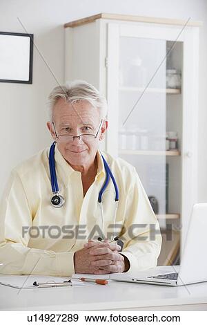 Stock Photo - Portrait of senior doctor . Fotosearch