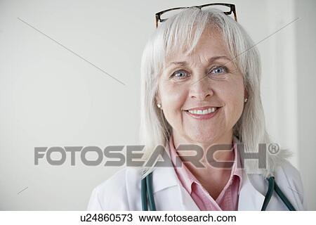 Portrait of senior female doctor View Large Photo Image Stock Image - Portrait of senior female doctor. Fotosearch