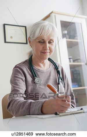Portrait of senior female doctor View Large Photo Image Stock Photo - Portrait of senior female doctor. Fotosearch