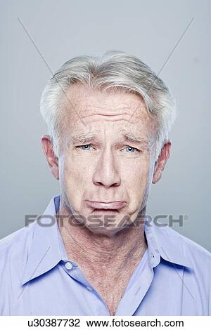 Portrait of senior man making sad face, studio shot View Large Photo Image Stock Image - Portrait of senior man making sad face, studio shot. Fotosearch