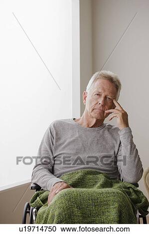 Stock Image - Portrait of senior man on wheelchair. Fotosearch