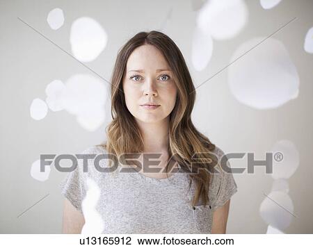 Stock Image - Portrait of serene young woman. Fotosearch