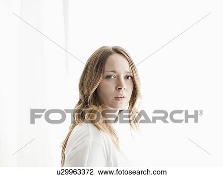 Stock Image - Portrait of serene young woman. Fotosearch