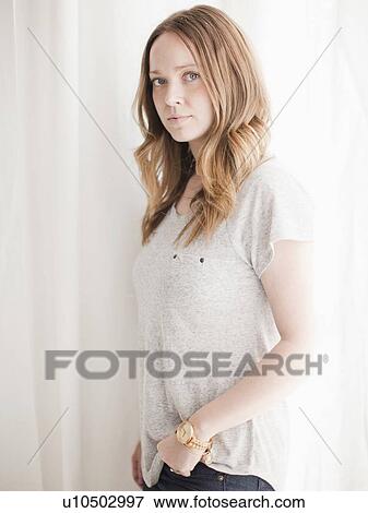 Stock Photo - Portrait of serene young woman. Fotosearch