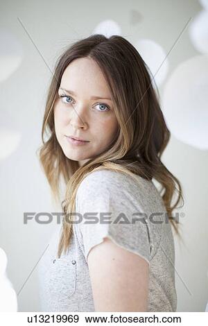Stock Photo - Portrait of serene young woman. Fotosearch