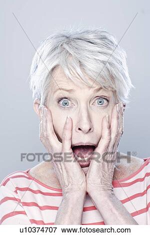 Portrait of shocked senior woman, studio shot View Large Photo Image Stock Photo - Portrait of shocked senior woman, studio shot. Fotosearch