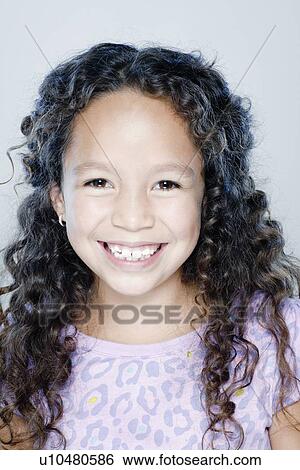 Portrait of smiling girl (8-9), studio shot View Large Photo Image Stock Photograph - Portrait of smiling girl (8-9), studio shot. Fotosearch