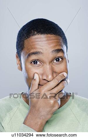 Picture - Portrait of smiling man, studio shot. Fotosearch