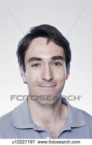 Portrait of smiling man, studio shot View Large Photo Image Stock Photo - Portrait of smiling man, studio shot. Fotosearch