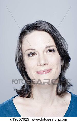 Portrait of smiling mid adult woman, studio shot View Large Photo Image Stock Image - Portrait of smiling mid adult woman, studio shot. Fotosearch