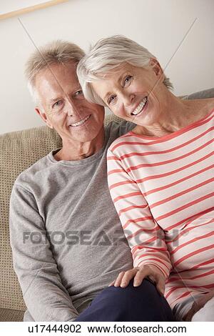 Stock Image - Portrait of smiling senior couple. Fotosearch