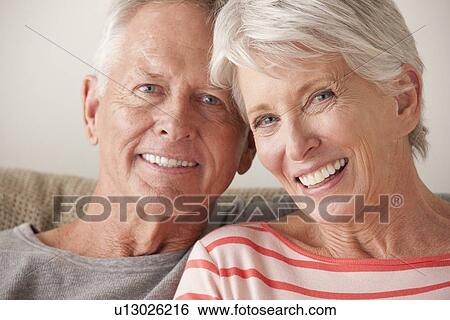 Stock Photograph - Portrait of smiling senior couple. Fotosearch