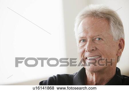 Stock Photo - Portrait of smiling senior man. Fotosearch