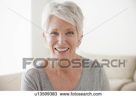 Stock Image - Portrait of smiling senior woman. Fotosearch
