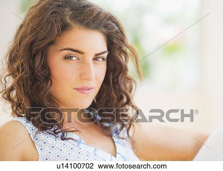 Stock Image - Portrait of smiling woman. Fotosearch