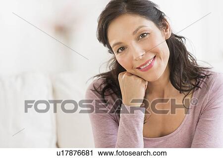 Stock Image - Portrait of smiling woman. Fotosearch