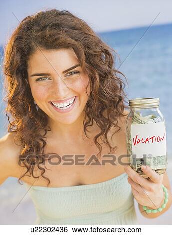 Portrait of smiling woman with vacation found View Large Photo Image Stock Photograph - Portrait of smiling woman with vacation found. Fotosearch