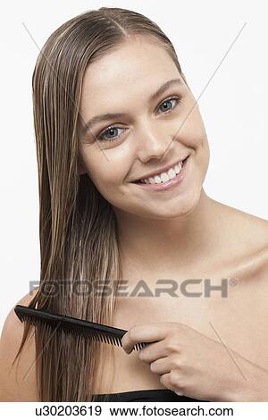 Portrait of smiling woman with wet hair View Large Photo Image Stock Photo - Portrait of smiling woman with wet hair. Fotosearch
