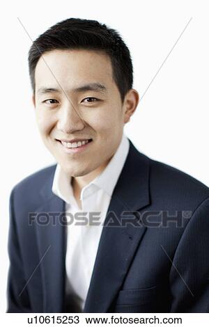 Portrait of smiling young man, studio shot View Large Photo Image Stock Image - Portrait of smiling young man, studio shot. Fotosearch
