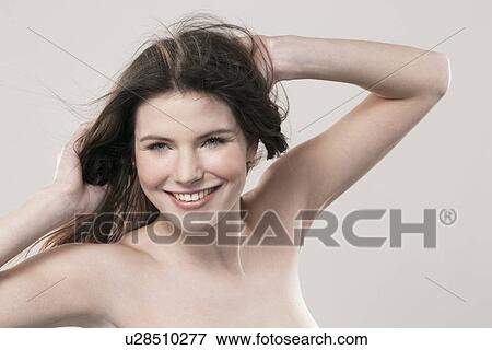 Stock Photo - Portrait of smiling young woman. Fotosearch