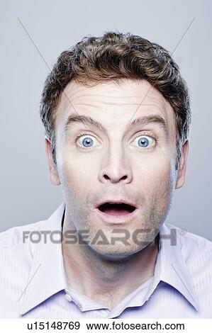 Portrait of surprised mid adult man, studio shot View Large Photo Image Stock Photo - Portrait of surprised mid adult man, studio shot. Fotosearch